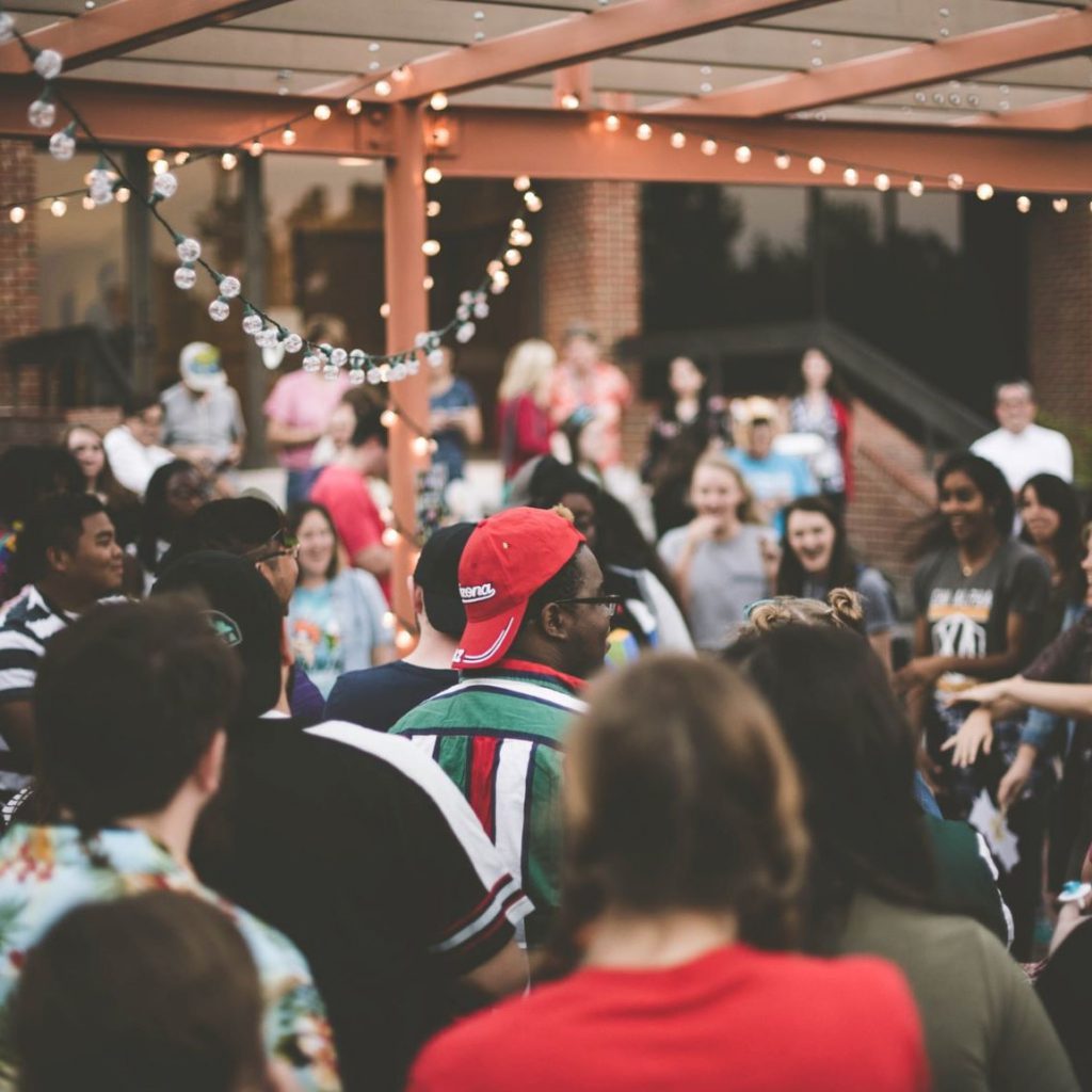 community celebrating through dance at a block party.